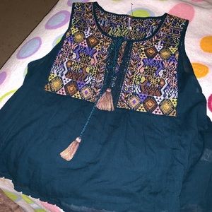 Free people teal shirt ! Can lower